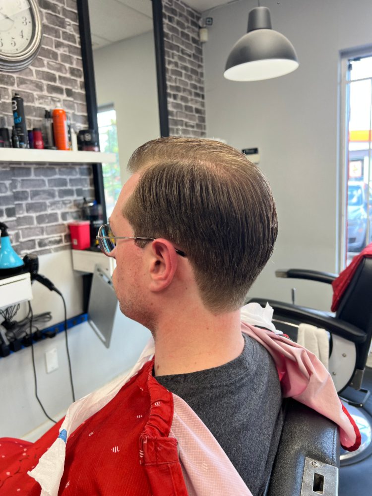 Slicked-back cut with a fade