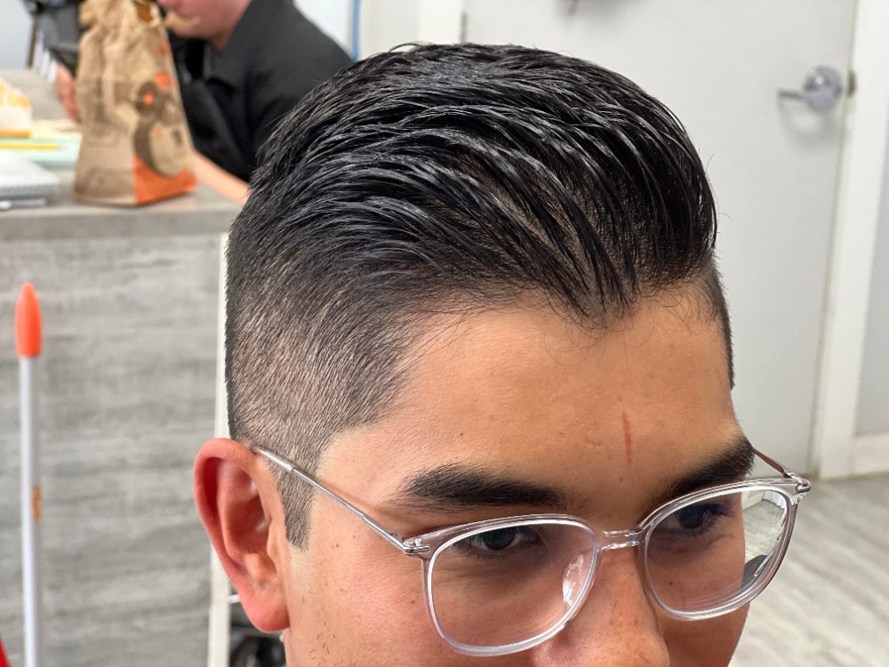 Slick side-part with a tapered fade